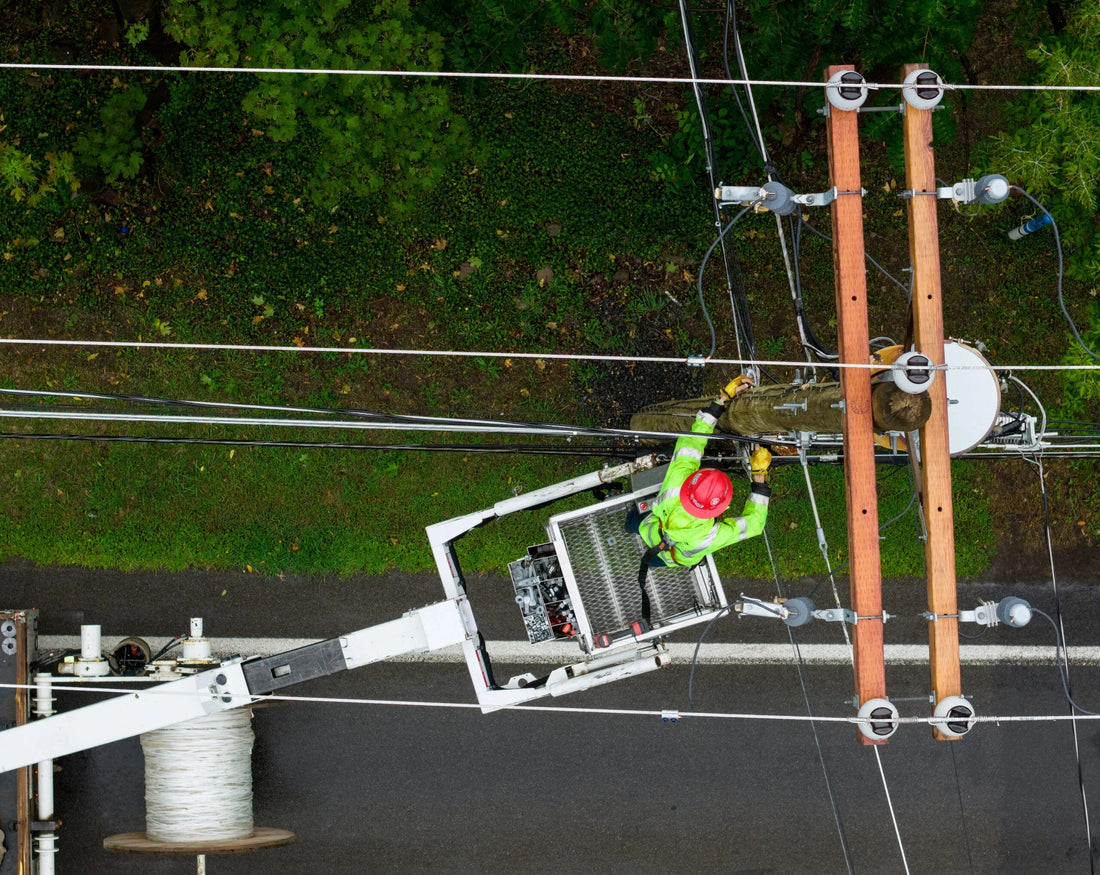 An Empire Fiber Internet technician works from a bucket truck to install fiber cable on a utility pole. (Patrick Schneider/Empire Fiber Internet)