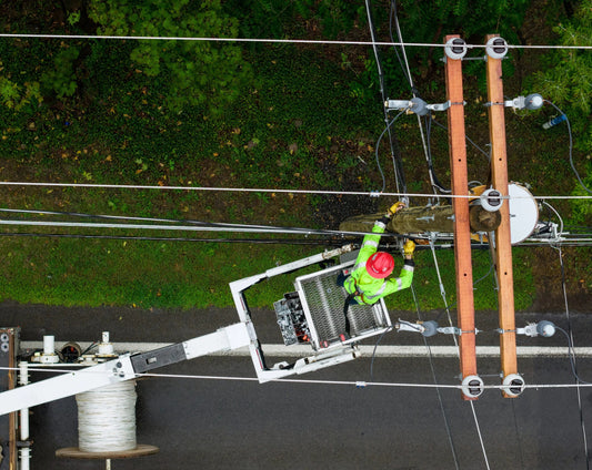 An Empire Fiber Internet technician works from a bucket truck to install fiber cable on a utility pole. (Patrick Schneider/Empire Fiber Internet)